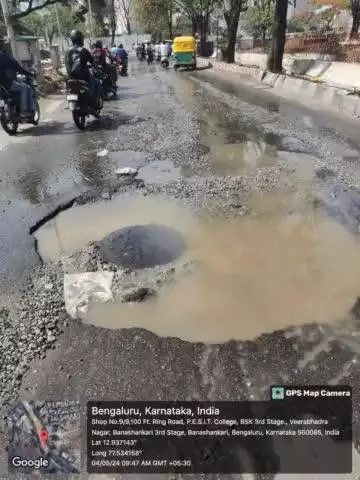 Slow-moving traffic due to  Drainage Water logging in Veerbhadra Nagar towards PES College, Kindly Co-operate. Be safe