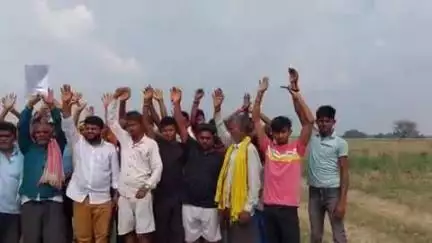 बनिया हसनपुर व माधोपुर में रिंग बांध निर्माण को लेकर किसानों का विरोध, निजी भूमि में मिट्टी गिराए जाने पर हुआ हंगामा