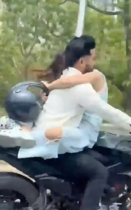 लड़की को गोद में बैठाकर दौड़ाई बाइक, नोएडा पुलिस ने काटा ₹53,500 का चालान