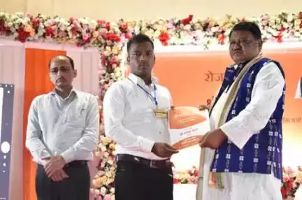 candidate receiving appointment letter at Rozgar Mela, Sambalpur