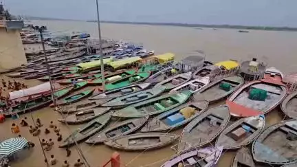 The Ganga's rising water submerged riverside temples. Boat services suspended