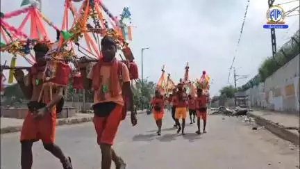 Delhi: Devotees return with Ganga Jal from Haridwar, carrying the sacred water to their homes with devotion and faith.